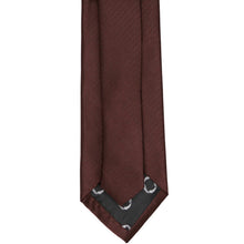 Load image into Gallery viewer, A close-up of a brown herringbone textured necktie with a patterned inner tip, set against a plain white background.