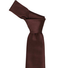 Load image into Gallery viewer, A brown herringbone tie knotted in a standard knot, displayed against a solid white background.