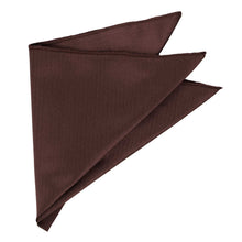 Load image into Gallery viewer, A folded brown pocket square made of textured herringbone fabric, shown on a plain white background.