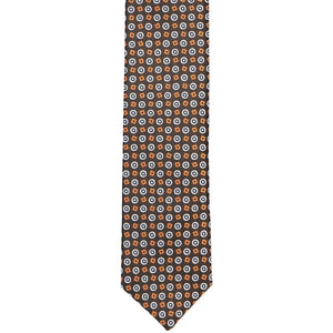 The front of a brown skinny pattern tie with squares and circles