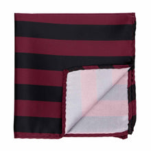 Load image into Gallery viewer, A burgundy and black striped pocket square with the corner folded up to show the inside