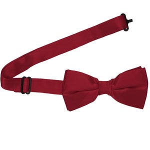 A pre-tied silk bow tie with the band collar open