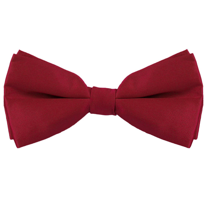 A pre-tied burgundy silk bow tie