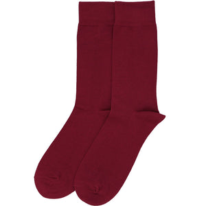 A pair of solid burgundy men's socks, laid out flat