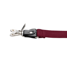 Load image into Gallery viewer, A close-up of a burgundy fabric strap with a black plastic buckle and open silver metal clips, shown against a plain white background.