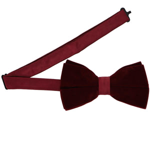 A pre-tied velvet bow tie with an adjustable band collar