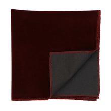 Load image into Gallery viewer, A burgundy velvet pocket square with a corner folded flipped up to show the back