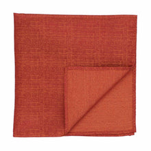 Load image into Gallery viewer, A folded burnt orange square pocket square with a subtle textured weave, shown on a plain white background.