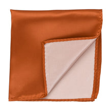 Load image into Gallery viewer, A burnt orange pocket square with a corner flipped up to show the back