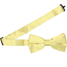 Load image into Gallery viewer, A butter yellow bow tie with the band collar open