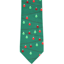 Load image into Gallery viewer, Flat view of a green novelty tie decorated with red and green Christmas ornaments