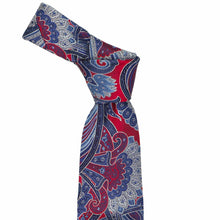 Load image into Gallery viewer, Knotted paisley tie with red, blue, and white design on a white background