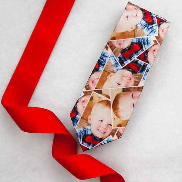 A photo tie displayed with a red Christmas ribbon