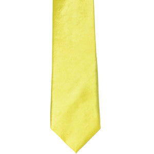 The front of a daffodil yellow slim tie, laid out flat