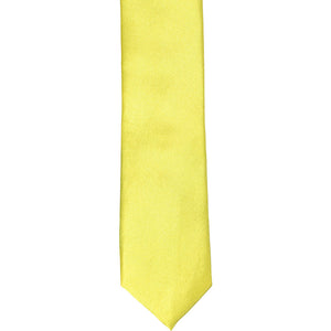 The front of a daffodil yellow skinny tie, laid flat