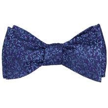 Load image into Gallery viewer, A dark purple and dark blue pebble pattern bow tie, tied
