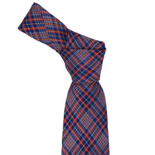 Load image into Gallery viewer, A dark blue plaid necktie tied into a knot