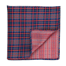 Load image into Gallery viewer, A folded plaid pocket square in a dark blue, red, and white pattern, with one corner folded over to show the reverse side.