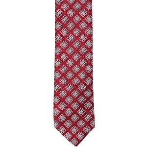 The front of a dark crimson tie with a medallion pattern