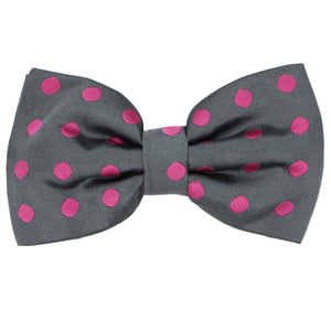 A playful gray pre-tied bow tie with medium-sized fuchsia polka dots all over