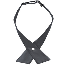 Load image into Gallery viewer, A dark gray crossover tie with a single pearl button closure, laid flat against a solid white background.