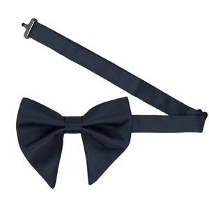 A pre-tied dark navy oversized bow tie with the band collar open