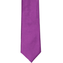 Load image into Gallery viewer, The front of a dark orchid slim tie, laid out flat