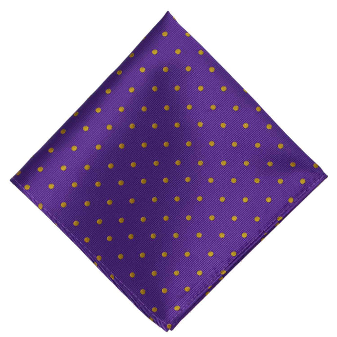 A dark purple and gold polka dot pocket square