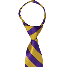Load image into Gallery viewer, A closeup of the knot on a dark purple and gold striped zipper tie