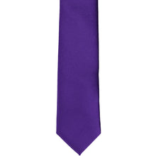 Load image into Gallery viewer, The front of a dark purple skinny tie, laid flat