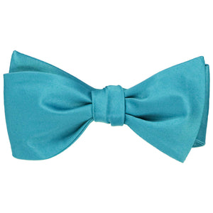 Solid color dark turquoise self-tie bow tie, tied