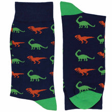 Load image into Gallery viewer, Folded men’s navy crew socks with orange T-Rex and green brontosaurus dinosaur pattern, dinosaur novelty socks for men