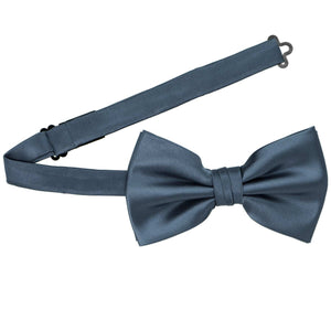 A dusty blue pre-tied bow tie with the band open