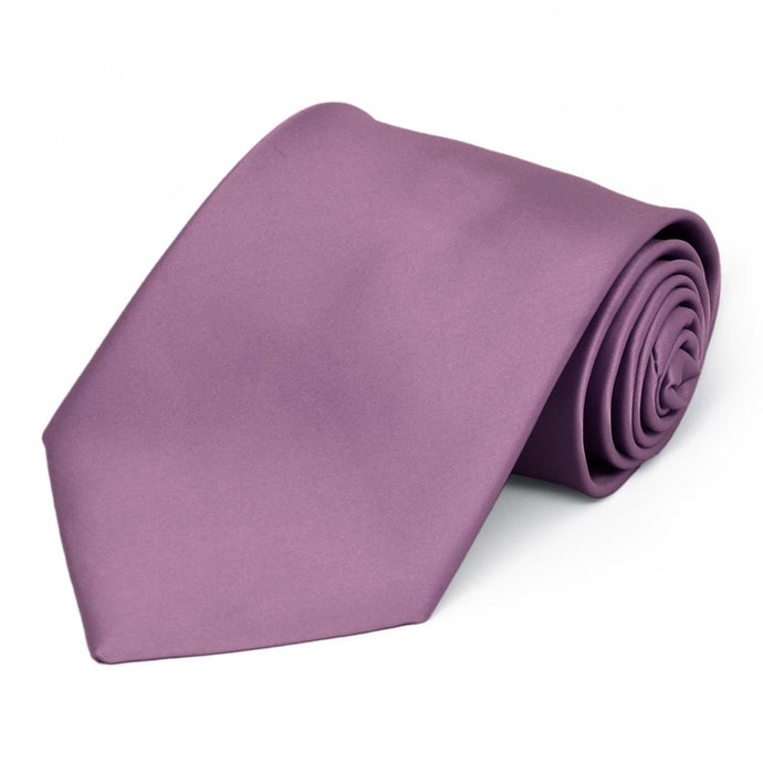 A dusty purple tie, rolled