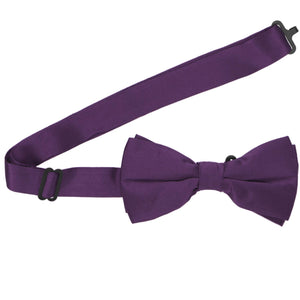 A pre-tied eggplant purple silk bow tie with the band open