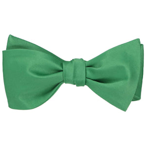 Emerald green self-tie bow tie, tied