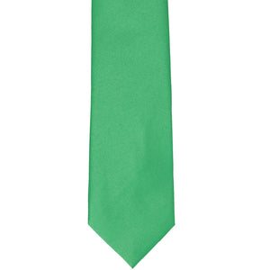 The front of an emerald green slim tie, laid out flat
