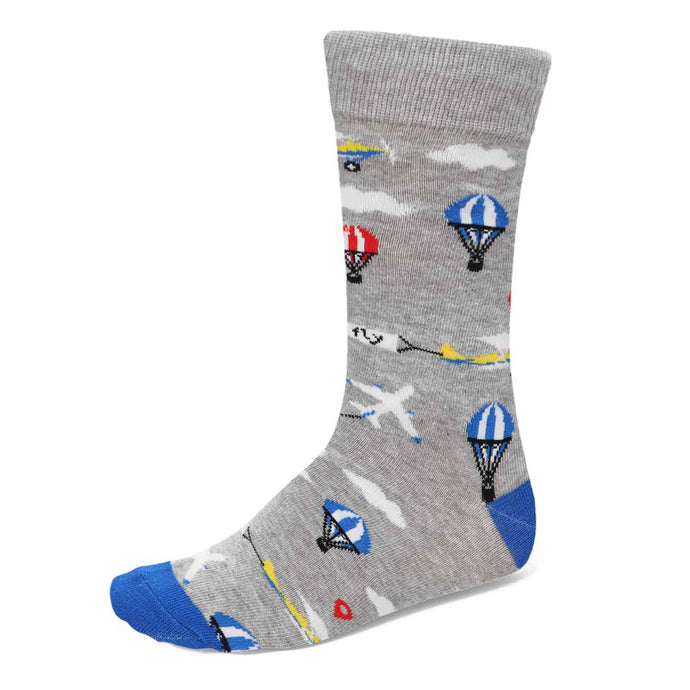 A men's gray sock with airplanes, hot air balloons and clouds