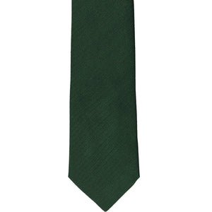 The front of a forest green herringbone slim tie, laid out flat