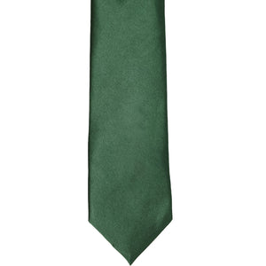 The front of a forest green slim tie, laid out flat