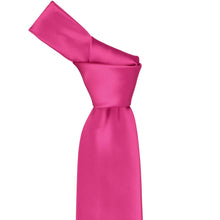 Load image into Gallery viewer, Close-up of a solid fuchsia necktie knot, highlighting the vibrant pink tone and subtle ribbed texture of the fabric.