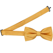 Load image into Gallery viewer, A pre-tied gold bar bow tie with the band collar open