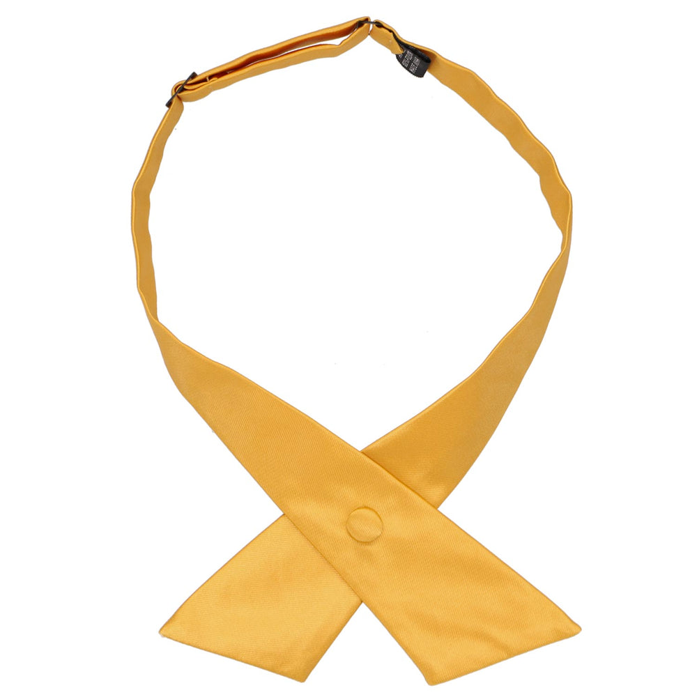 A gold bar colored crossover tie snapped closed
