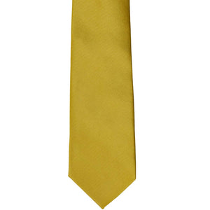The front of a gold solid color slim tie, laid out flat