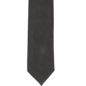 The front of a dark gray velvet tie, laid flat