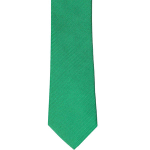 The front of a green slim tie with a tone-on-tone herringbone pattern