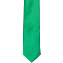 Load image into Gallery viewer, The front of a green skinny tie, laid flat