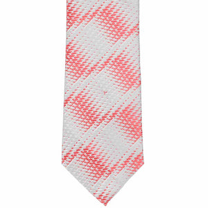The front of a guava and silver geometric tie, laid flat
