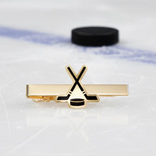 Load image into Gallery viewer, Hockey tie bar with an ice rink and puck in the background.