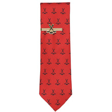 Load image into Gallery viewer, Hockey tie clip on a red tie with black hockey stick and puck pattern on a white background